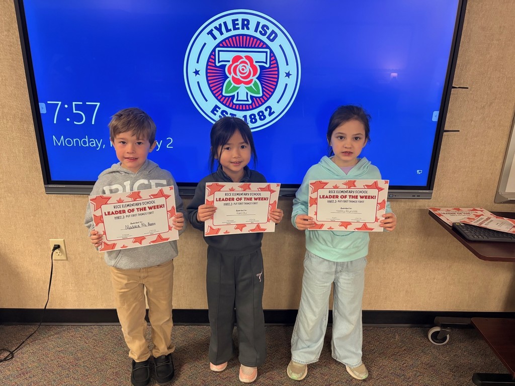 students holding certificates