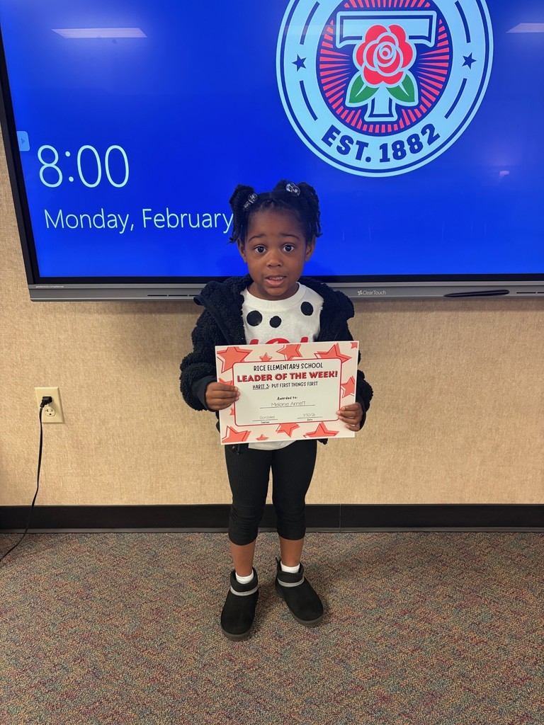 student holding a certificate