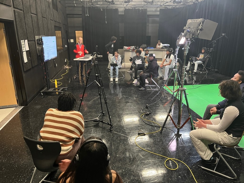 Audio/Video Production & Graphic Design students learning about 3-point lighting.