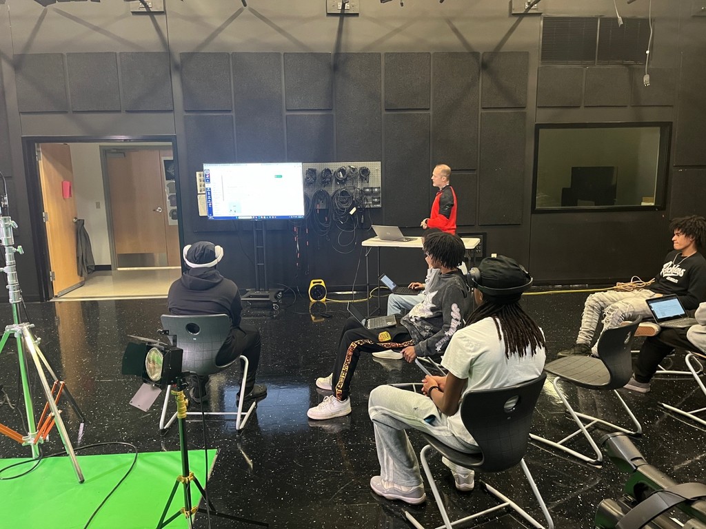 Audio/Video Production & Graphic Design students learning about 3-point lighting.