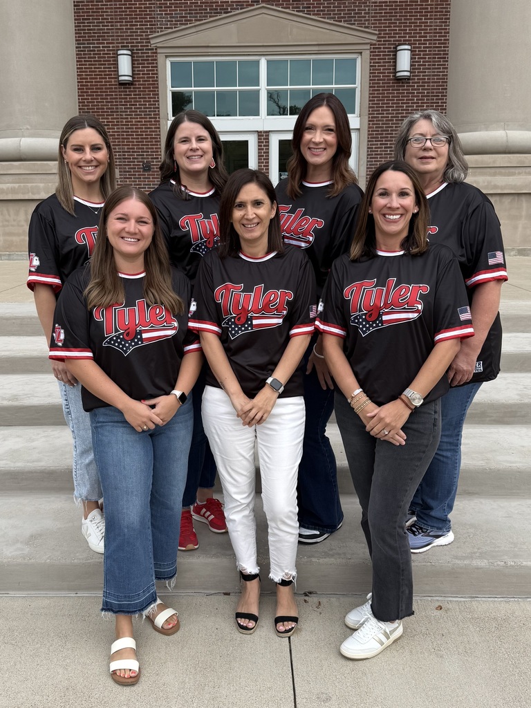 Tyler Legacy Counselors posing outside with their Tyler Legacy shirts