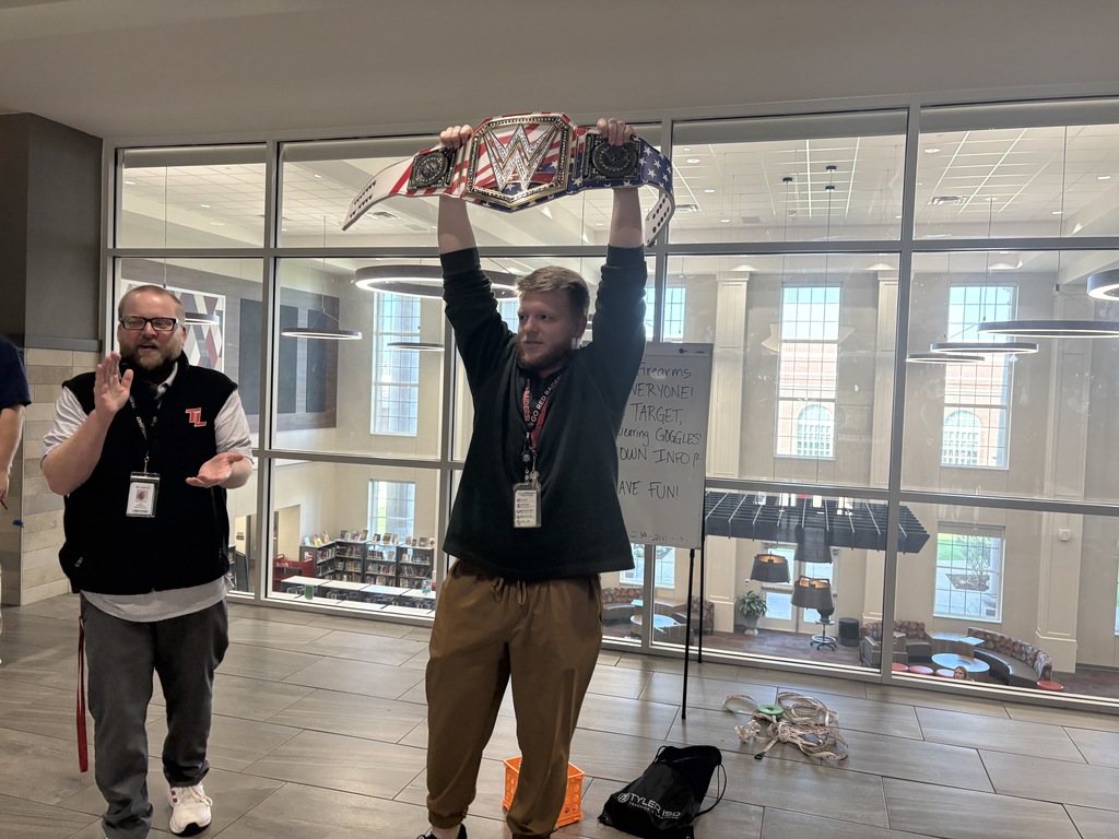 Tyler legacy's Walk Through Wednesday champion Mr. Smith holding the champion belt with Mr. H clapping