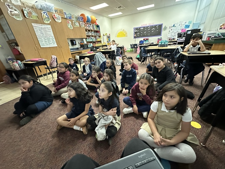 class sitting in the floor