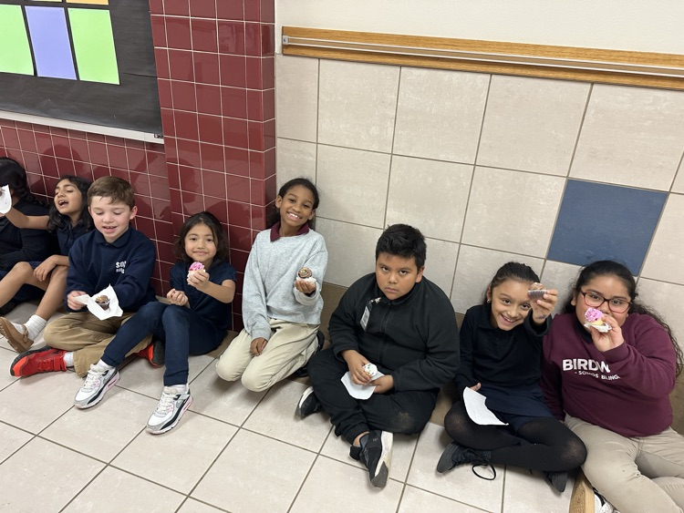 students sitting in the hallway
