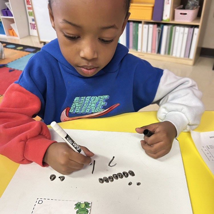 student working in a math small group