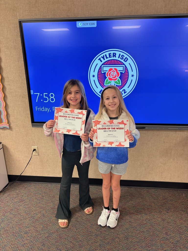 students holding certificates