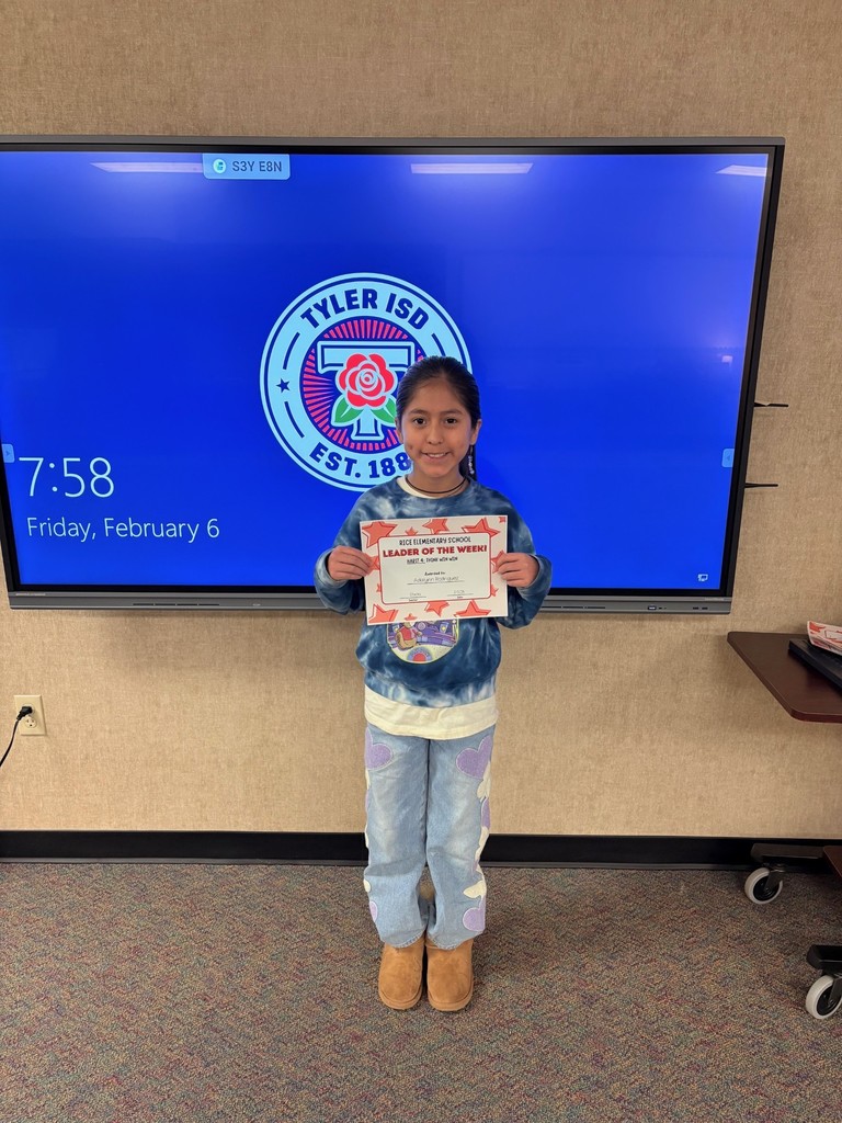 student holding a certificate