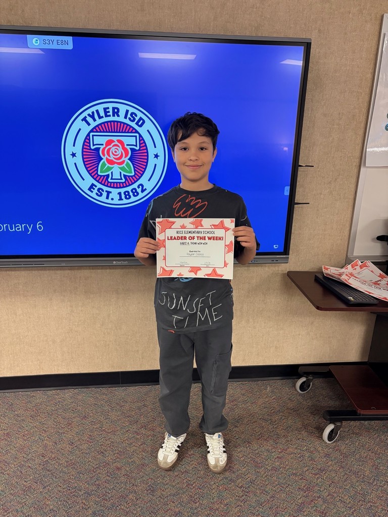 student holding a certificate