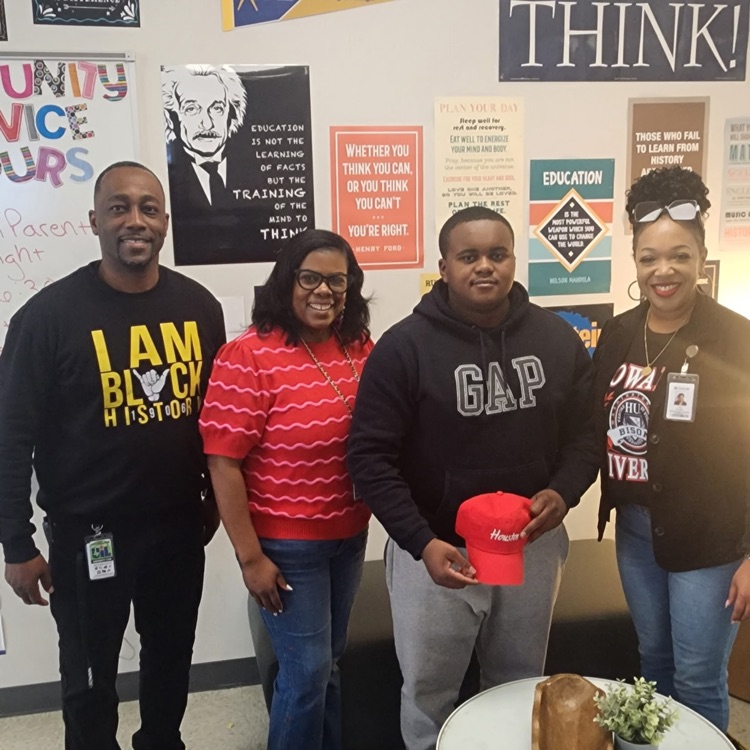 4 people posing for picture