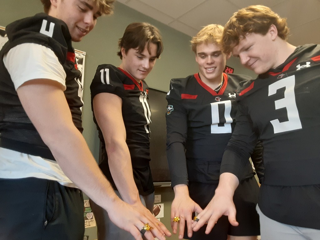 High School Football players wearing rings