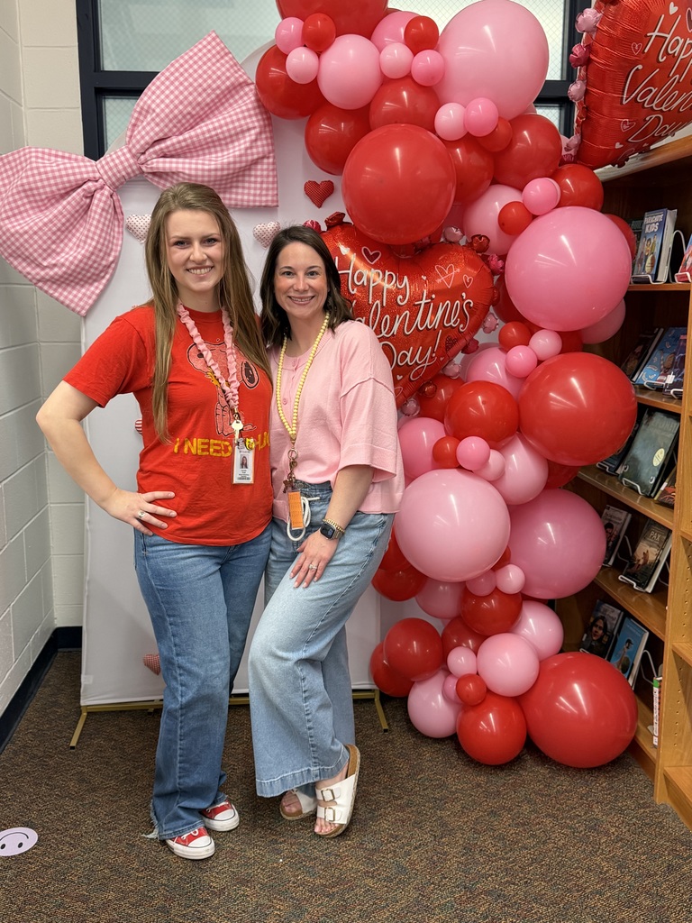 Librarian and librarian aid at the book fair.