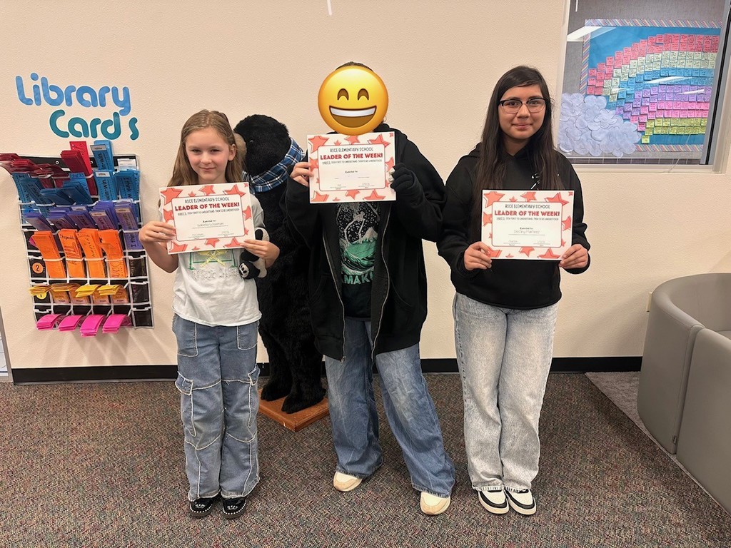 students holding certificates