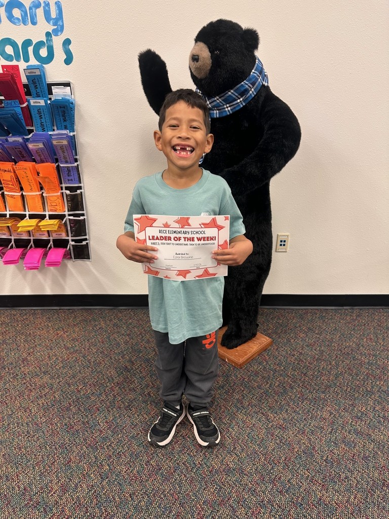 student holding a certificate