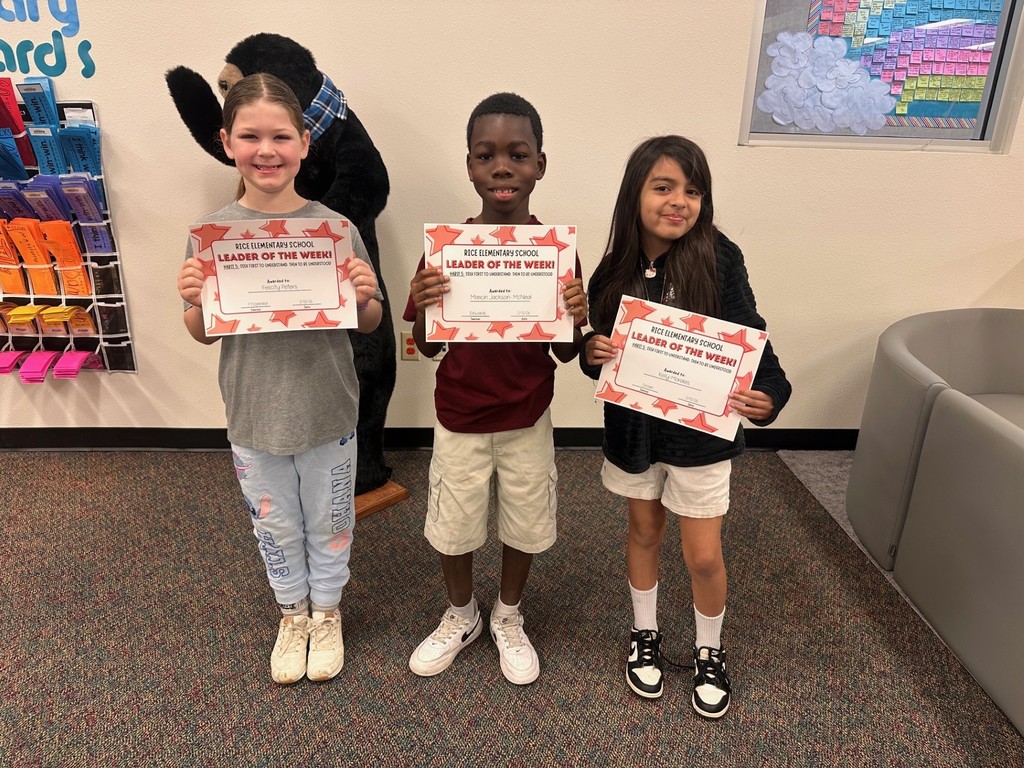 students holding certificates