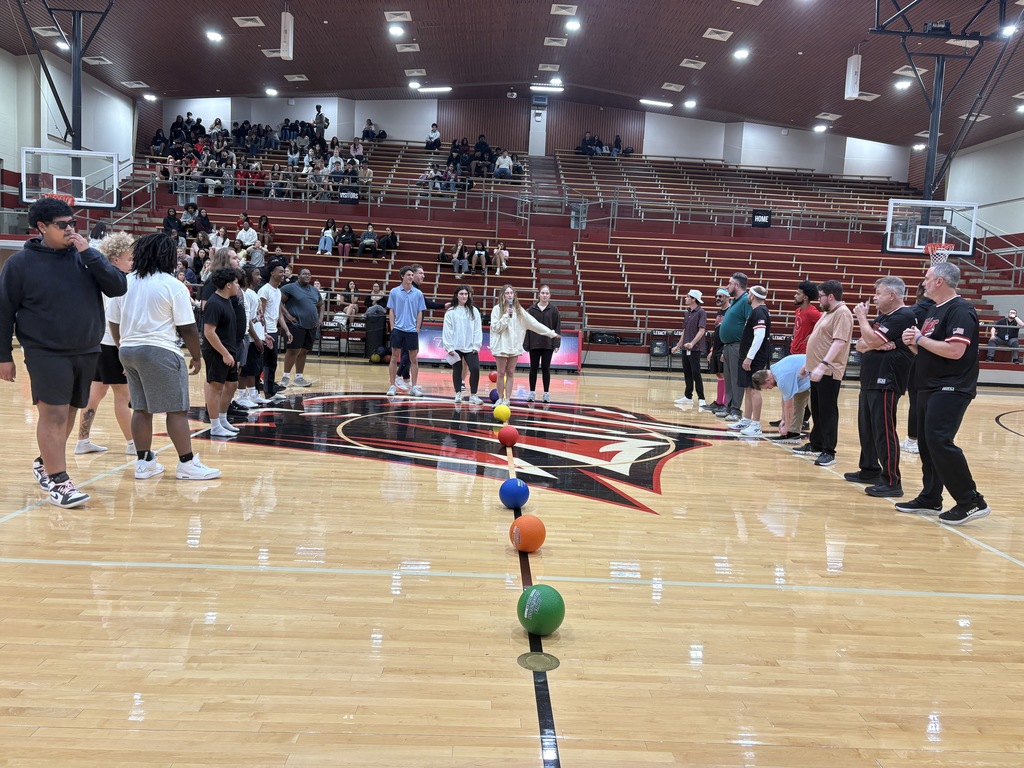 Tyler Legacy student and teacher dodgeball teams lined up before the game