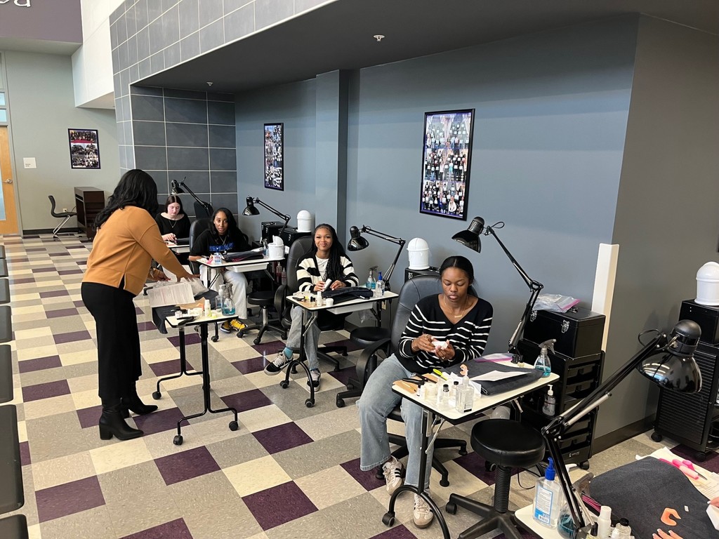 Cosmetology 2 students practicing on nails for the state board exam.
