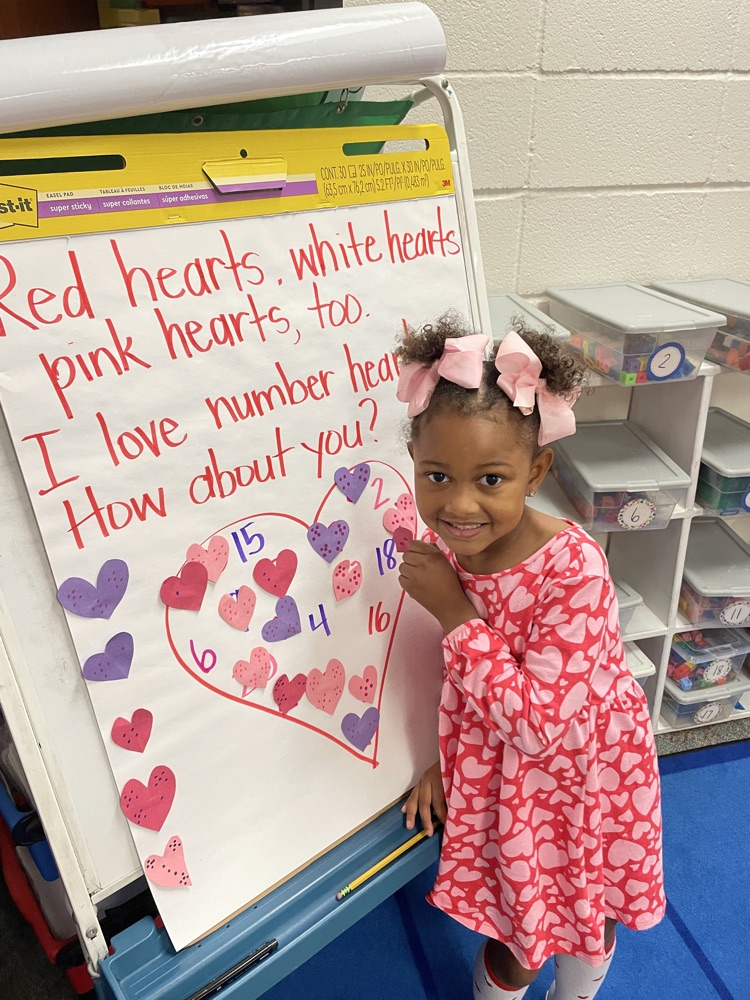 Kids doing Valentine activities.