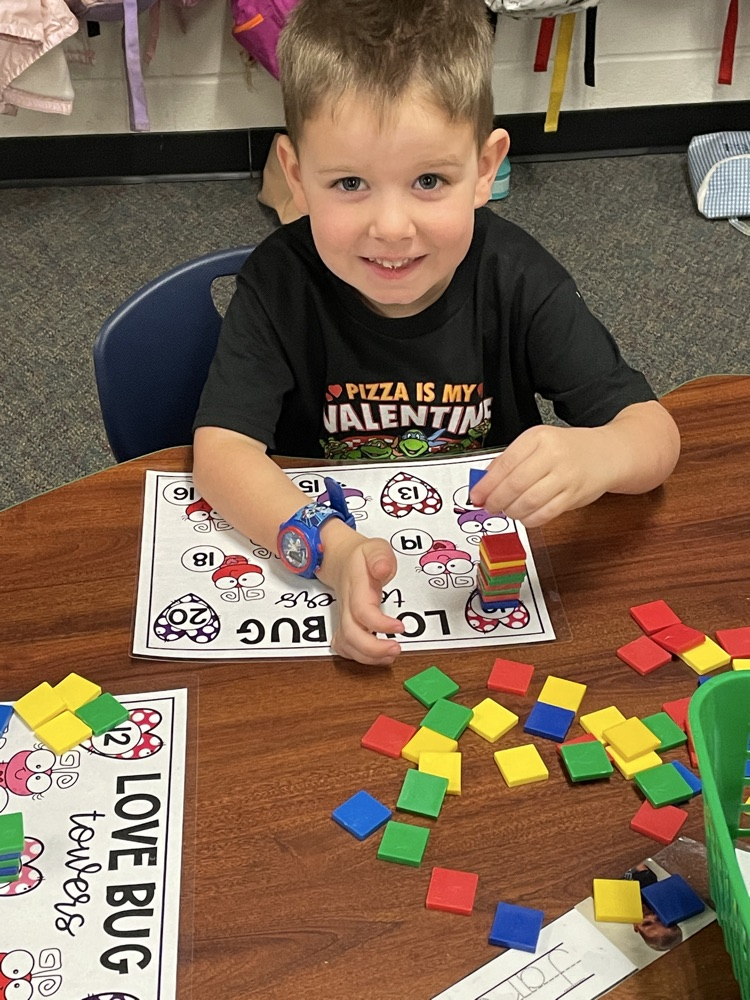 Kids doing Valentine activities.