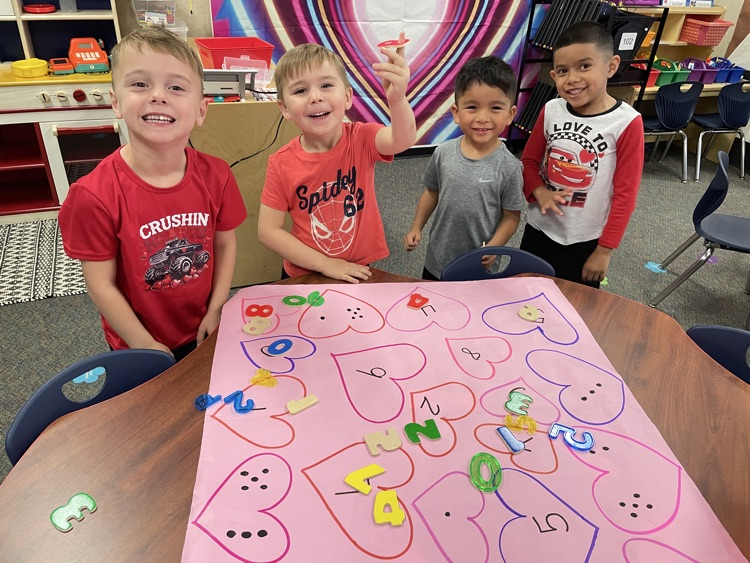 Kids doing Valentine activities.