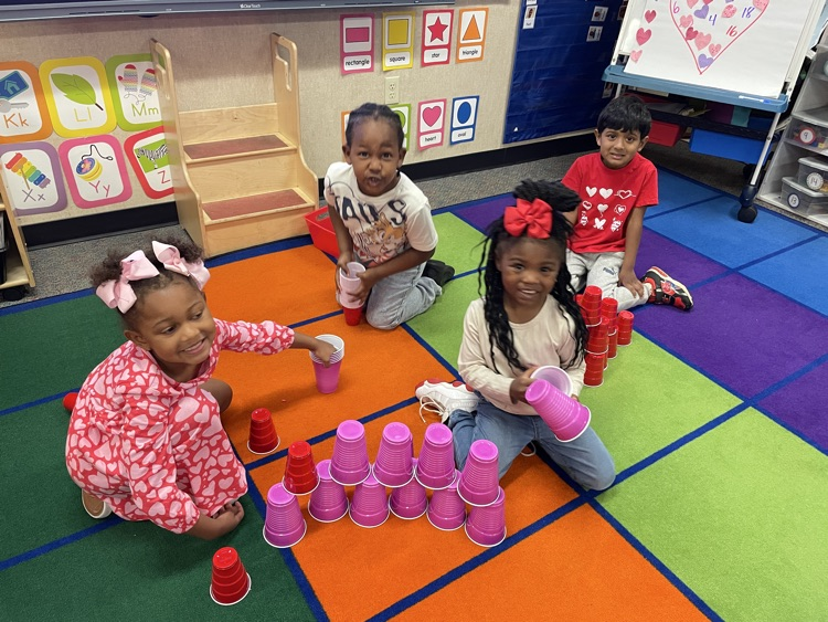 Kids doing Valentine activities.