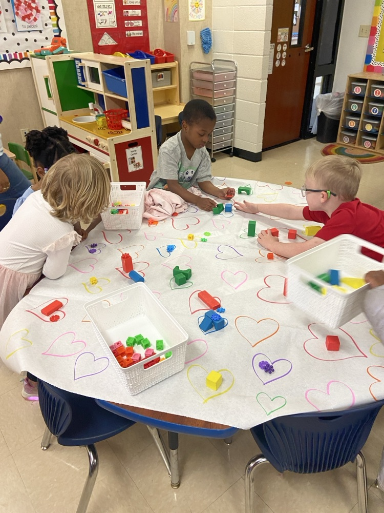 Kids doing Valentine activities.
