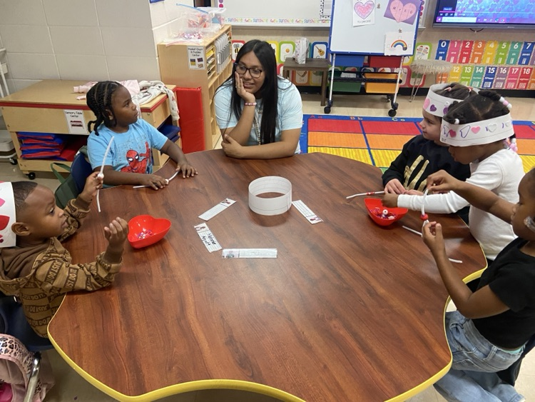 Kids doing Valentine activities.