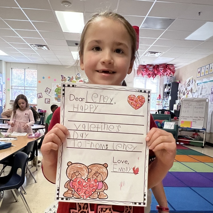 Student displaying valentine’s writing