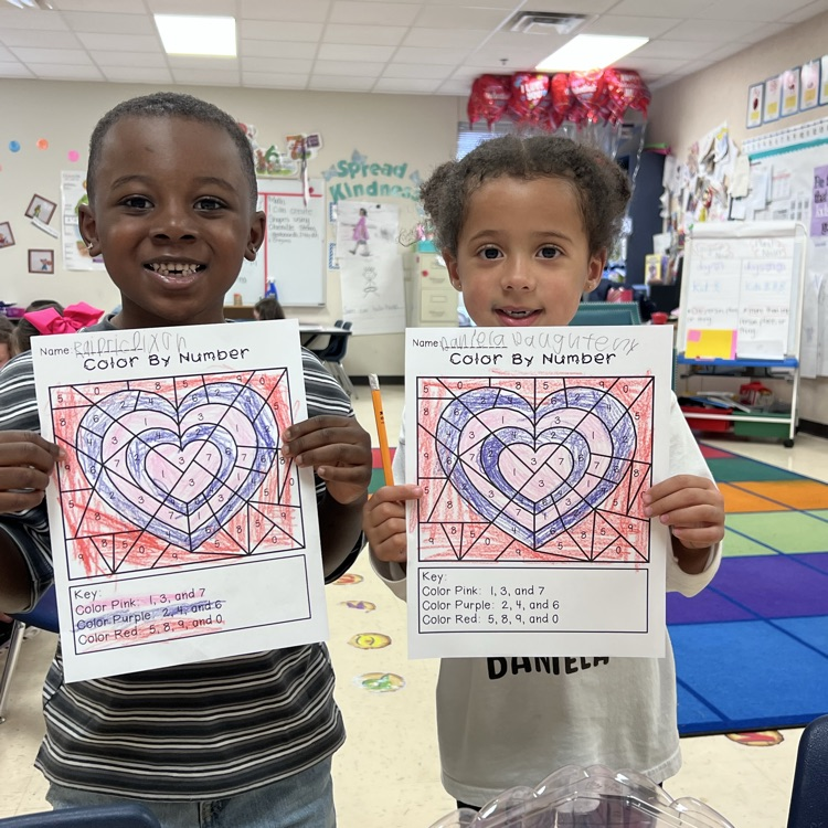 Students displaying valentine’s writing