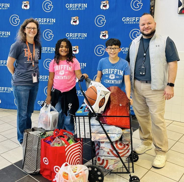 students and donor with prizes
