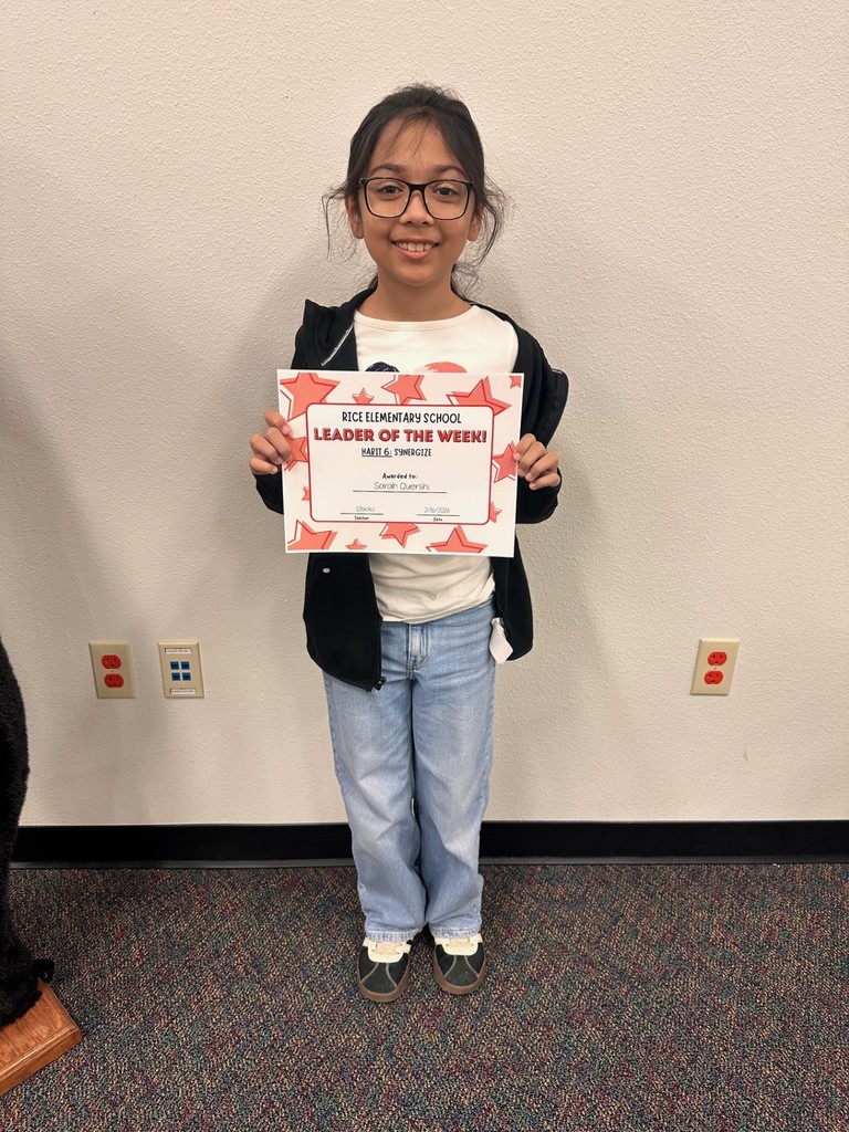 student holding a certificate