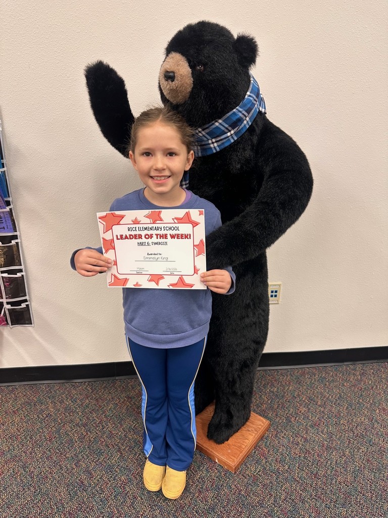 student holding a certificate