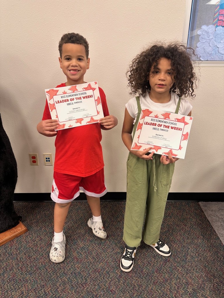 students holding certificates