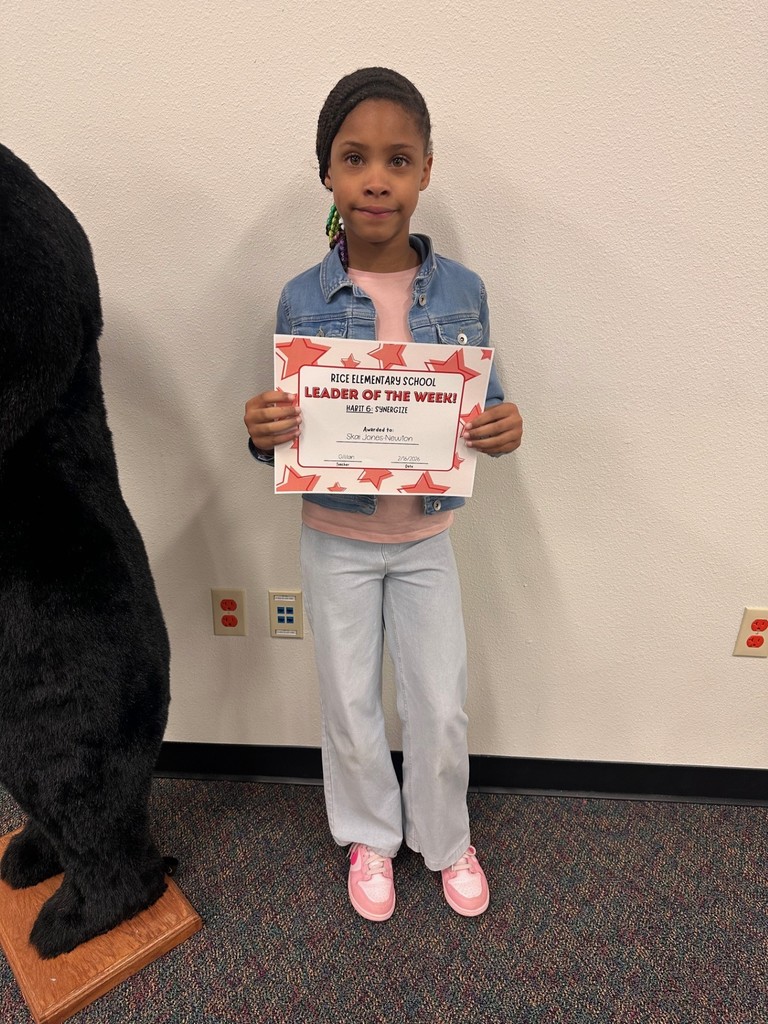 student holding a certificate