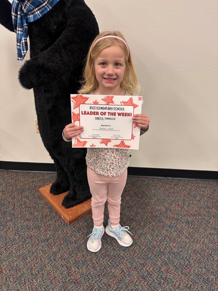 student holding a certificate