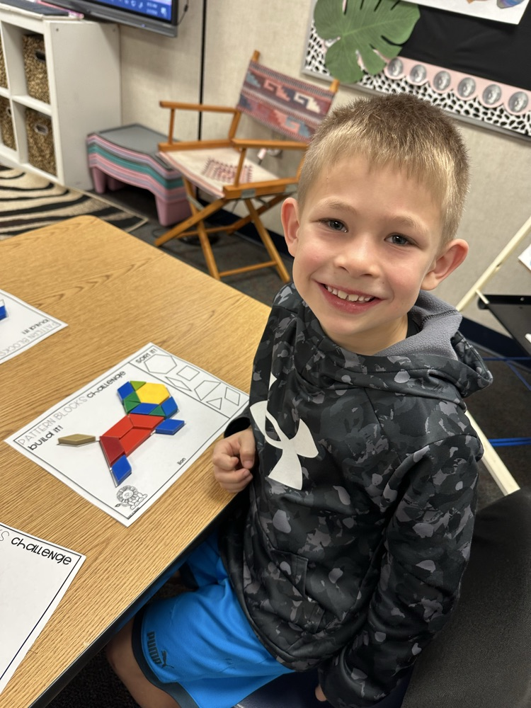 first graders using manipulatives to create 2d and 3D shape models