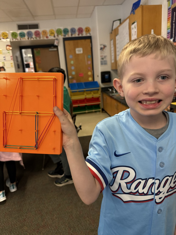 first graders using manipulatives to create 2d and 3D shape models