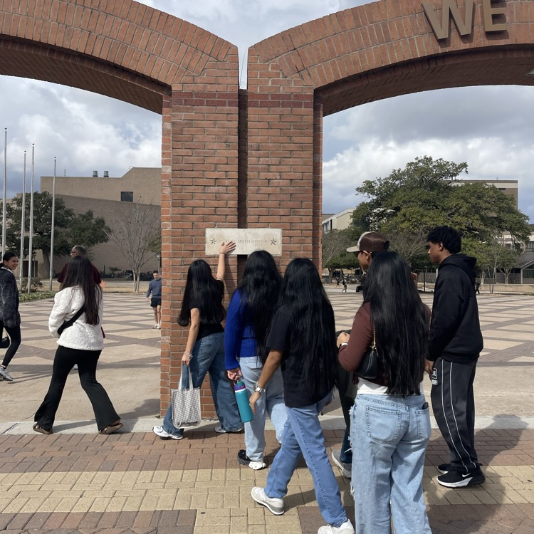 student walking through gate
