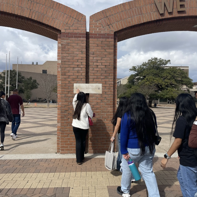 students walking through gate