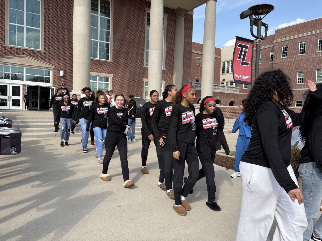 Tyler Legacy Girls Varsity Basketball walking through a sendoff to playoffs
