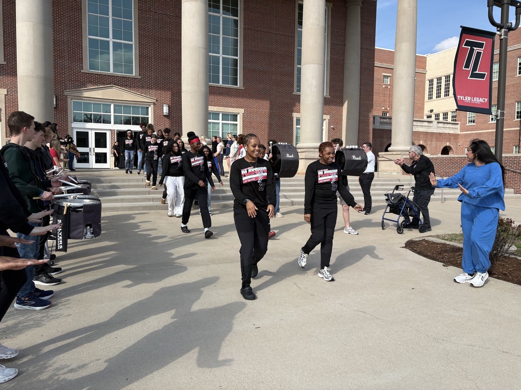 Tyler Legacy Girls Varsity Basketball walking through a sendoff to playoffs