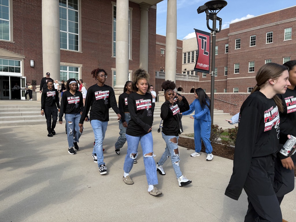Tyler Legacy Girls Varsity Basketball walking through a sendoff to playoffs