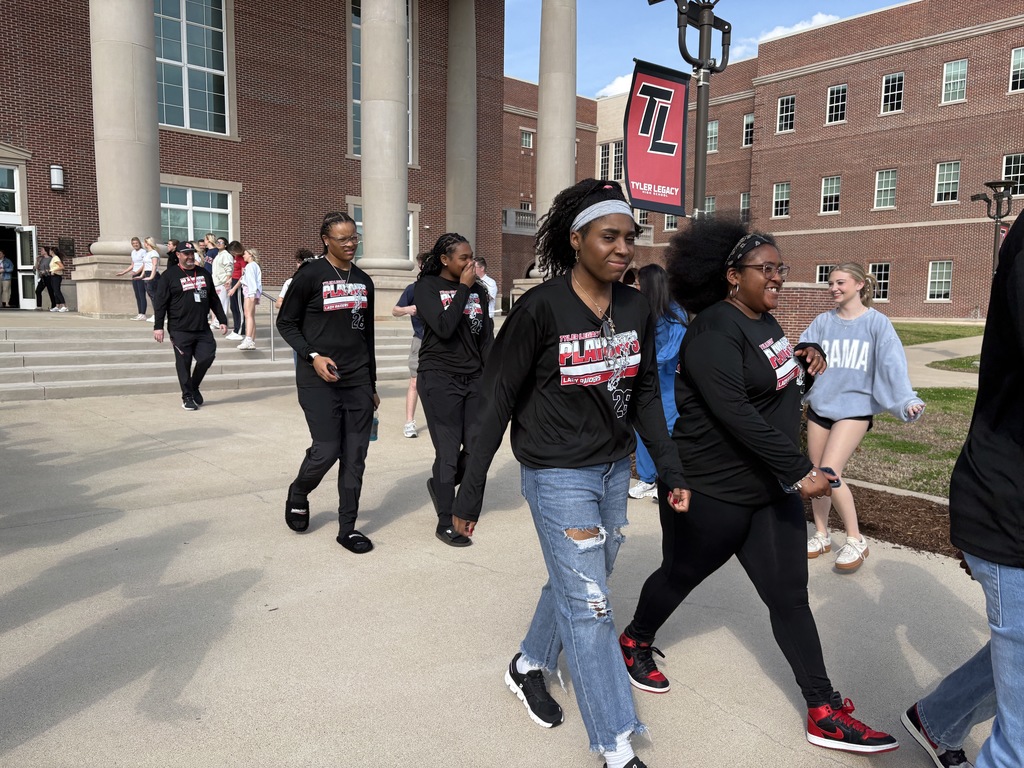Tyler Legacy Girls Varsity Basketball walking through a sendoff to playoffs