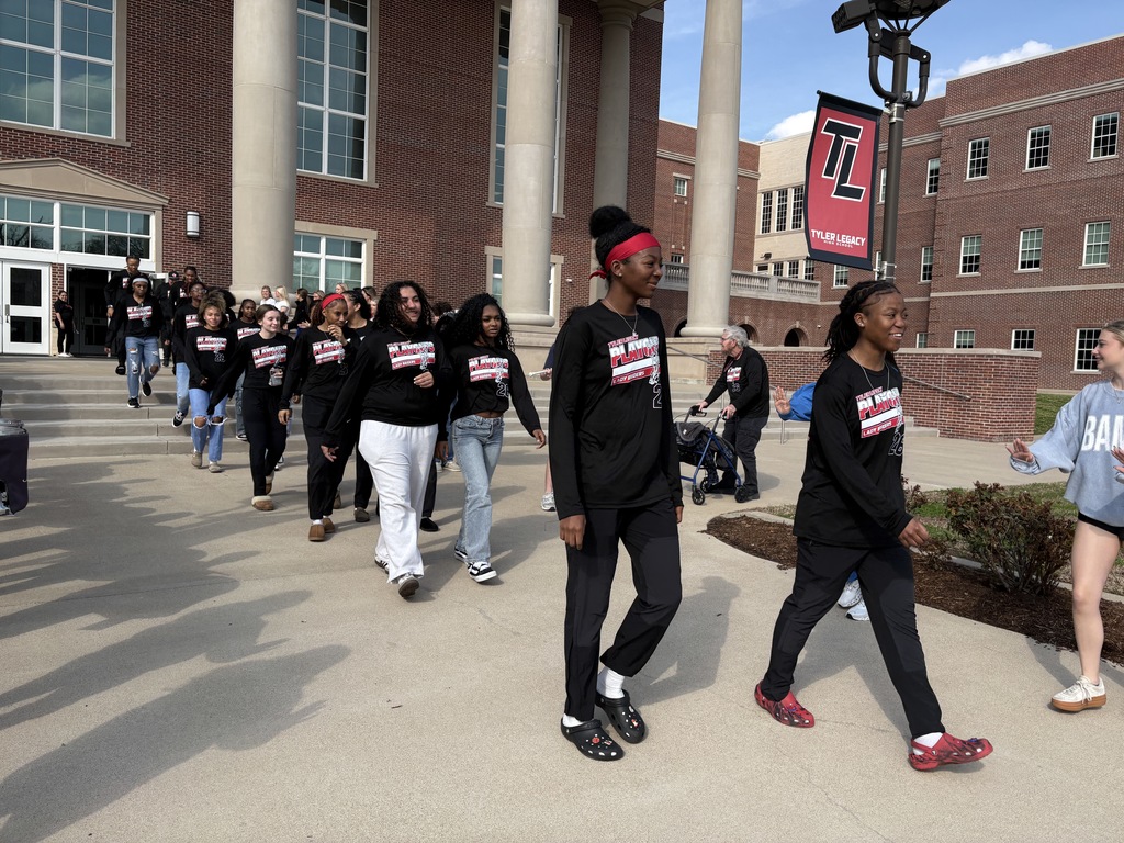 Tyler Legacy Girls Varsity Basketball walking through a sendoff to playoffs