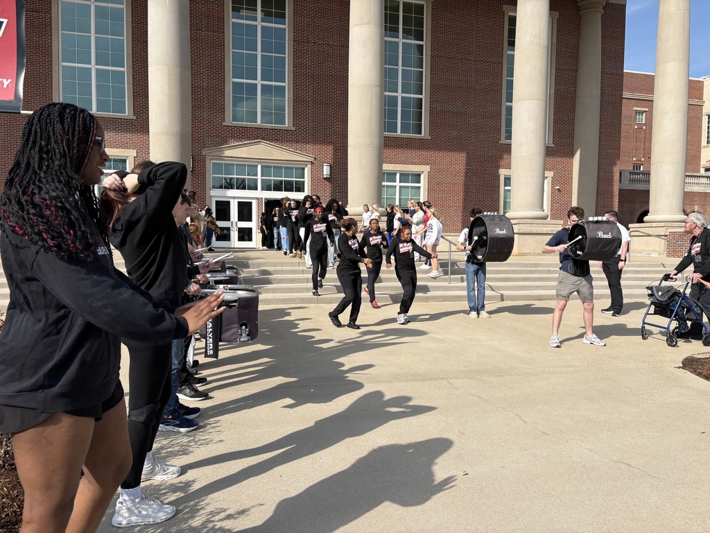 Tyler Legacy Girls Varsity Basketball walking through a sendoff to playoffs
