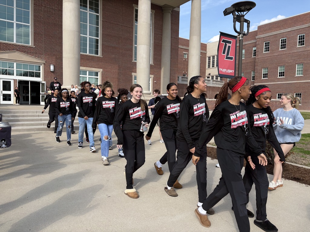 Tyler Legacy Girls Varsity Basketball walking through a sendoff to playoffs
