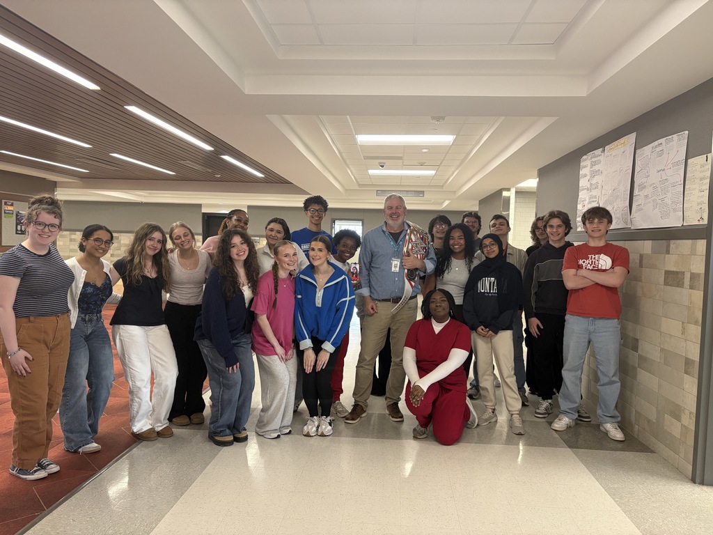 Tyler legacy's Walk Through Wednesday champion Mr. Showen holding the champion belt with one of his classes
