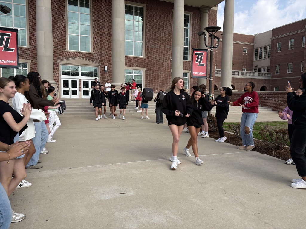 Tyler Legacy state swim qualifiers walking out of Tyler Legacy on their way to state