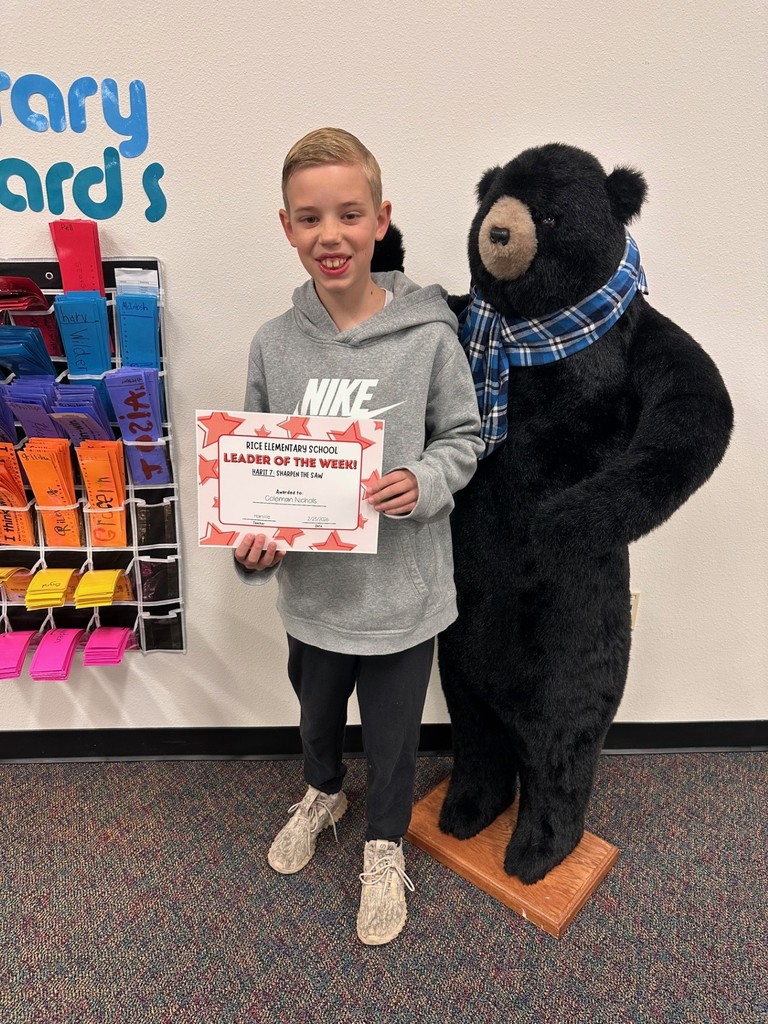 student holding a certificate