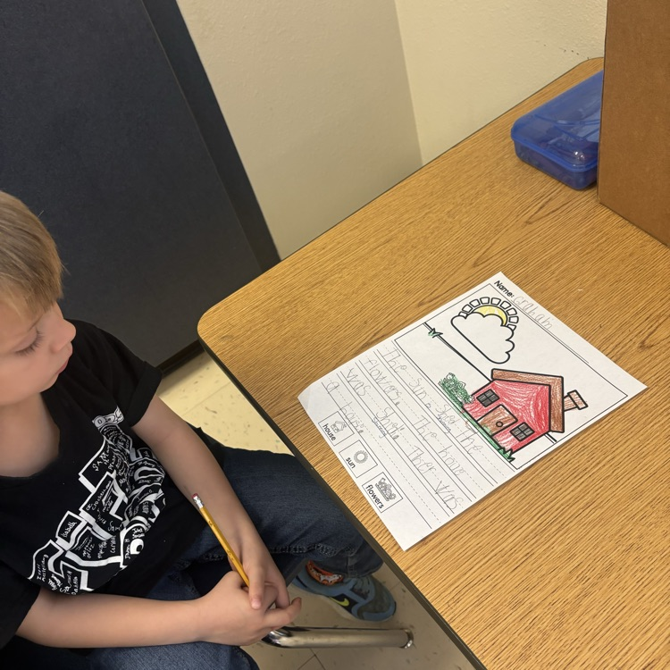 students writing in class