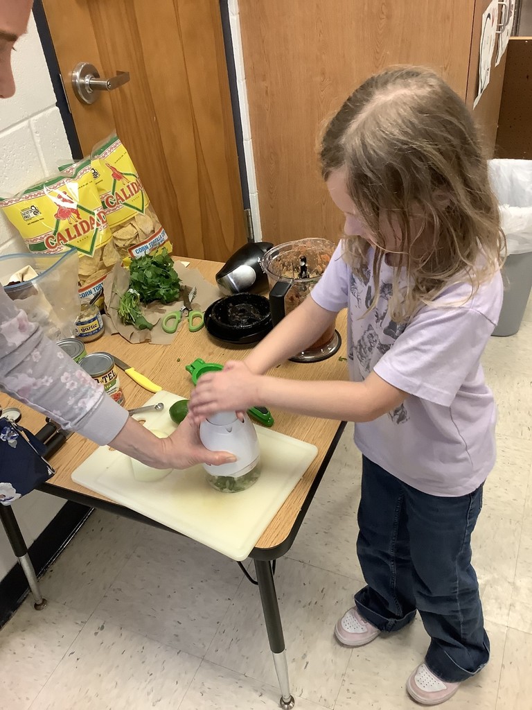Kindergarten students making salsa.